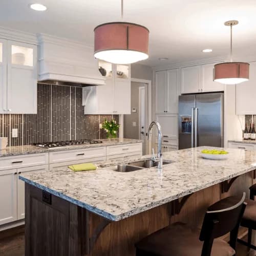 Example: kitchen with a dark island, granite top and glass-tile backsplash